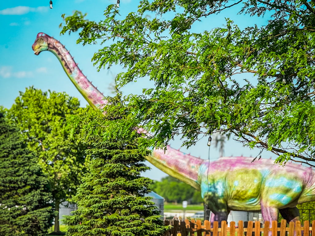 Green and pueple skin animatronic Mamenchisaurus at jurassic farm